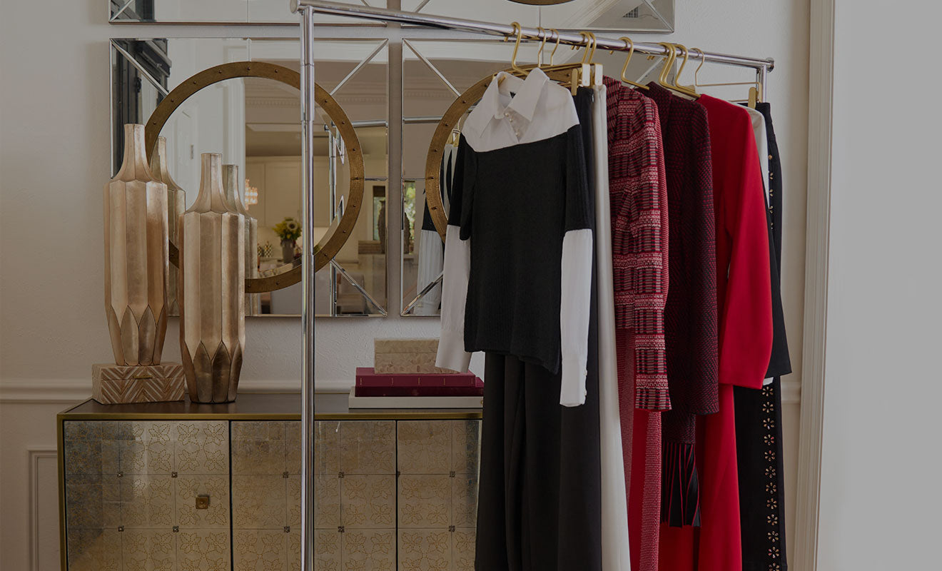 A line review rack of finished garments in the showroom